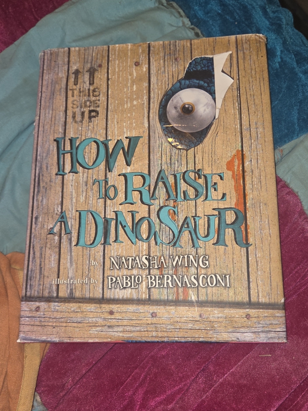 " HOW TO RAISE A DINOSAUR"BY NATASHA WING